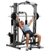 Body-Solid Powerline PSM1442XS Smith Gym Gym model exercising 