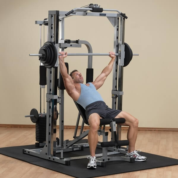 Body-Solid Powerline PSM1442XS Smith Gym in home with mat
