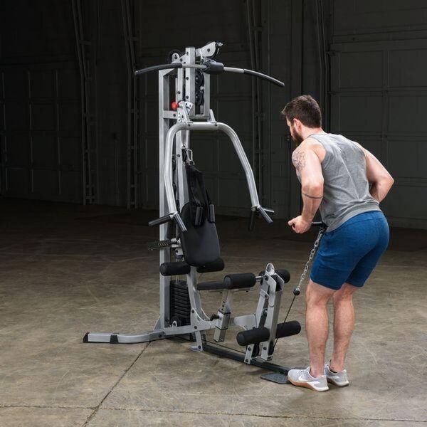 Body-Solid Powerline Single Stack Home Gym BSG10X male model  uses the lower pulley for bent over row exercises