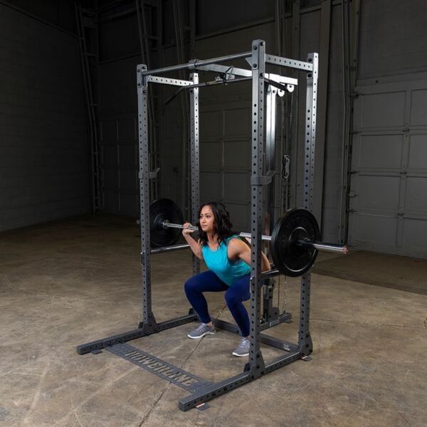 Body-Solid Powerline Pipe Pin and Safeties PPRPS with model squat lifting