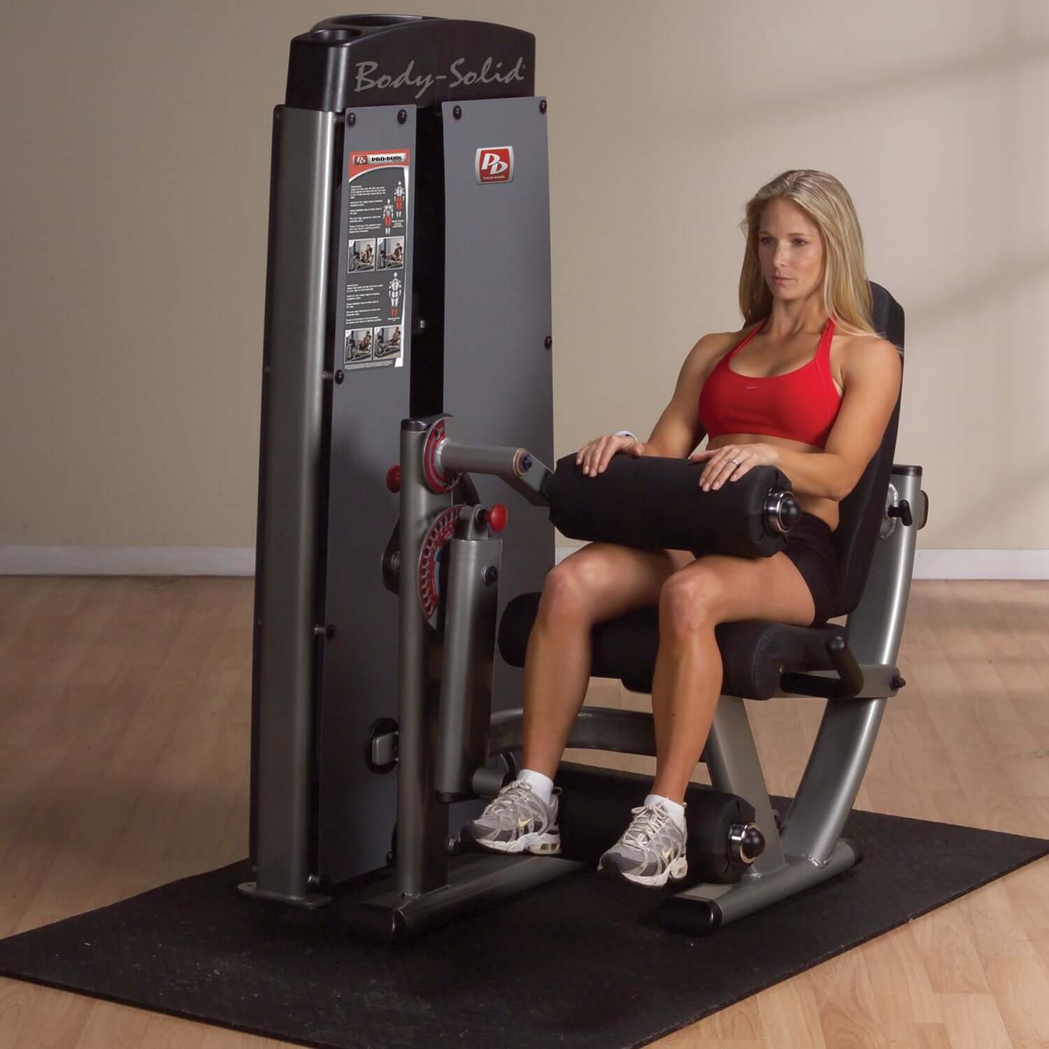 Body-Solid (DLEC-SF) Pro Dual Leg Extension & Curl Machine with fitness client