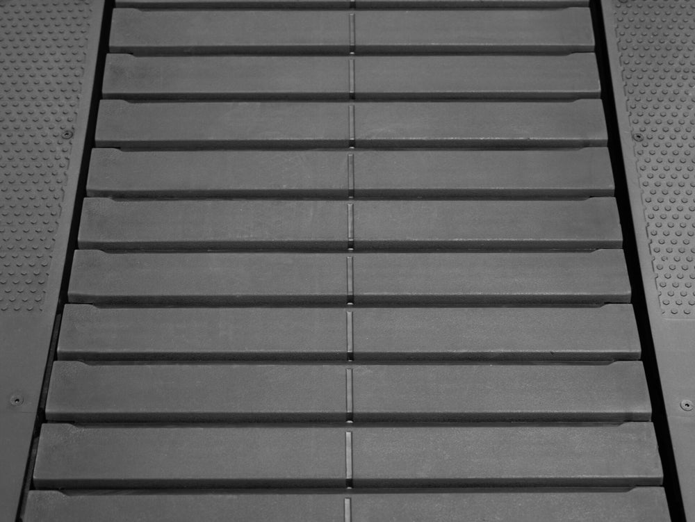 Gray treadmill slats of the BodyKore Air Runner- AR100