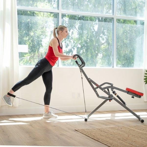Sunny Health & Fitness Row-N-Ride PRO™ Squat Assist Trainer Female Excercising