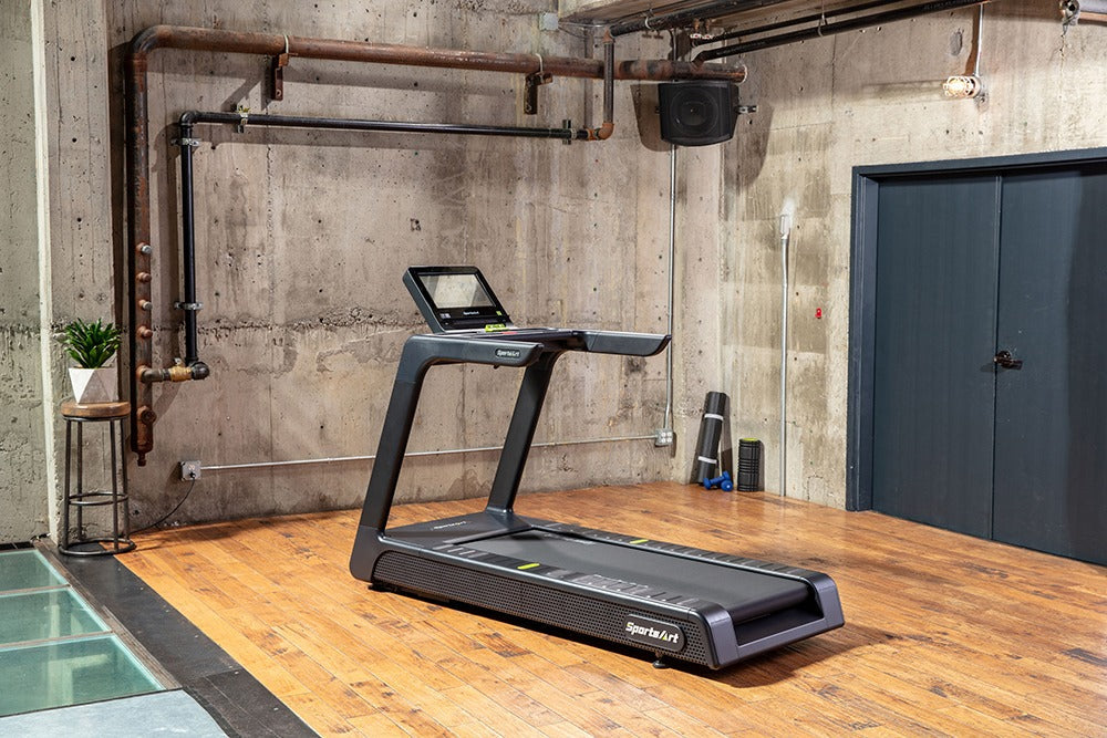 SportsArt Elite Senza Treadmill-16-inch - T674-16 side view angle inside a home gym setting