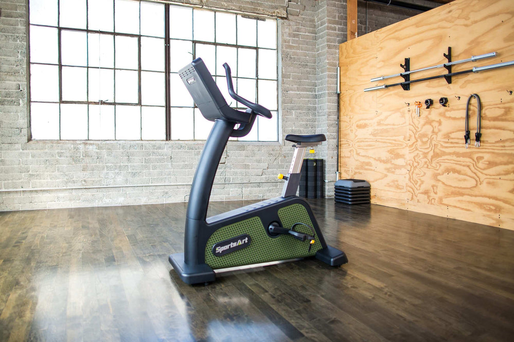SportsArt Status Eco-Powr Upright Cycle G576U side view with console toward left hand side inside a home gym 
