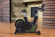 SportsArt Vatio Status Eco-Powr Cycle G516 side view inside a home gym 