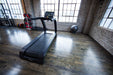 SportsArt Verde Status Eco-Powr Treadmill G690 back view inside home gym setting 
