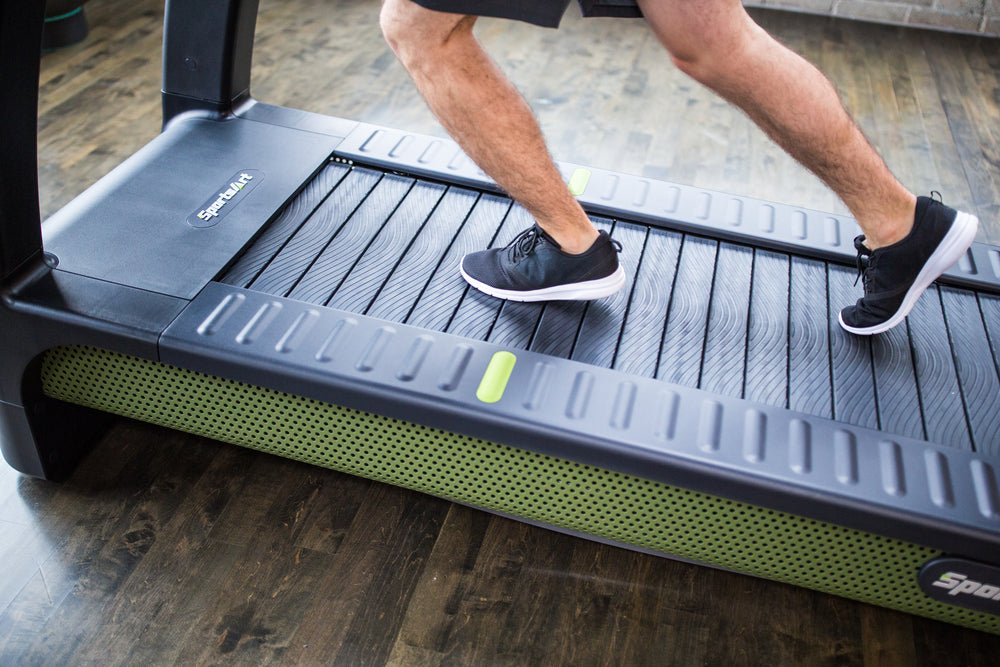 SportsArt Verde Status Eco-Powr Treadmill G690 user running on treadmill belt