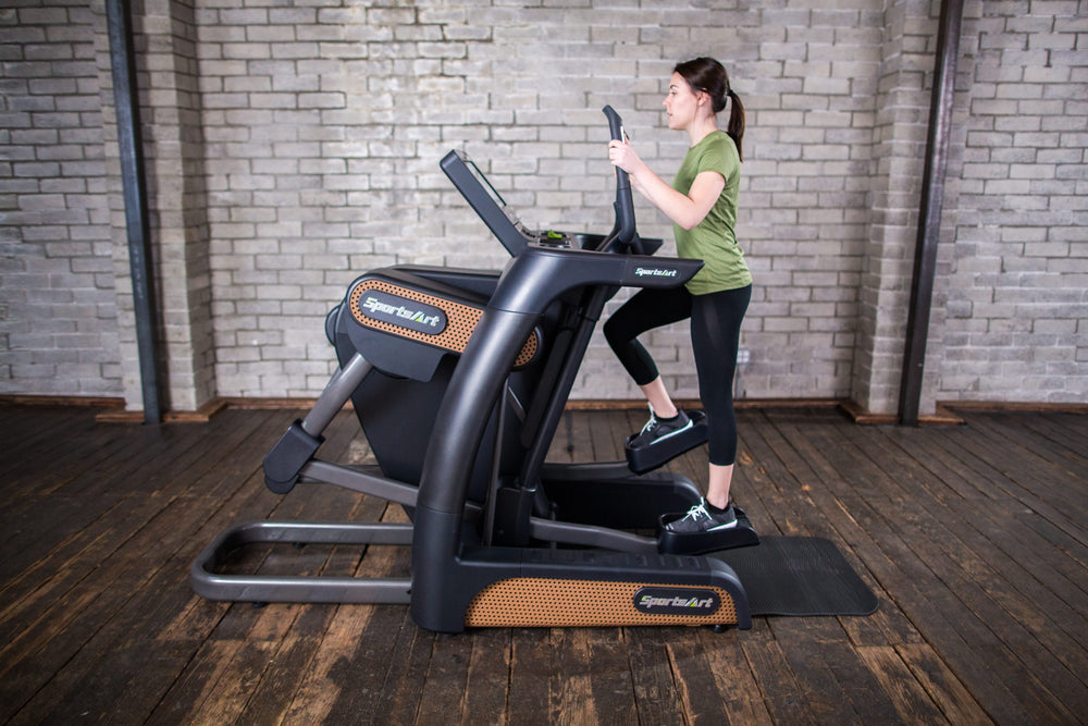 SportsArt Verso Status Senza Cross Trainer-16 inch V886-16 side view with user exercising