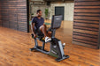 SportsArts Elite Eco-Powr Recumbent Cycle G574R male user exercising in home gym