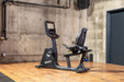 SportsArts Elite Senza Recumbent Cycle-13 inch C574R-13 side view inside a home gym 