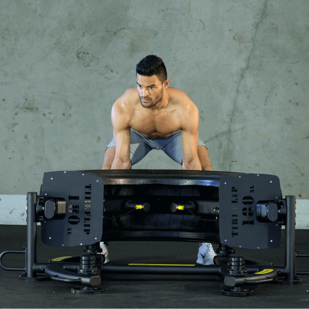 The Abs Company TireFlip 180 XL Ready Position